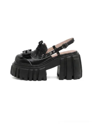 Black bow-front chunky platform Mary Jane sandals with glossy leather upper, adjustable slingback buckle, open toe and lug sole side view