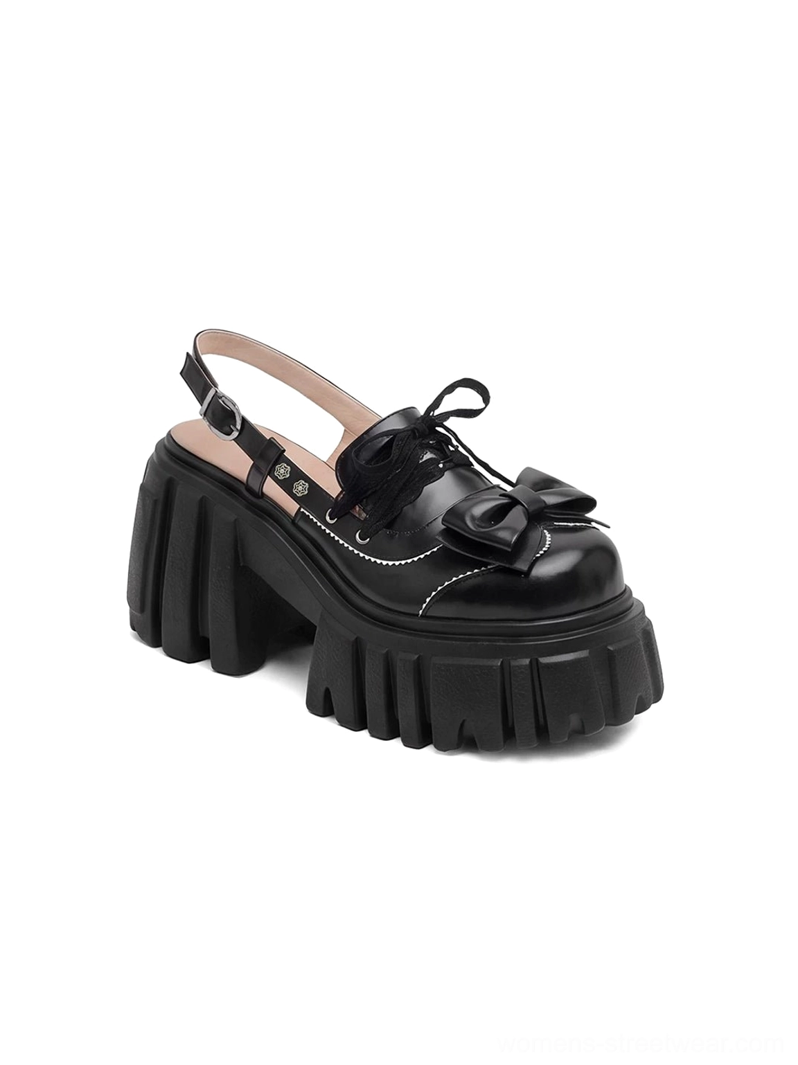 Top side product view of black bow-front chunky platform Mary Jane sandals showing pink sheepskin insole and slingback strap