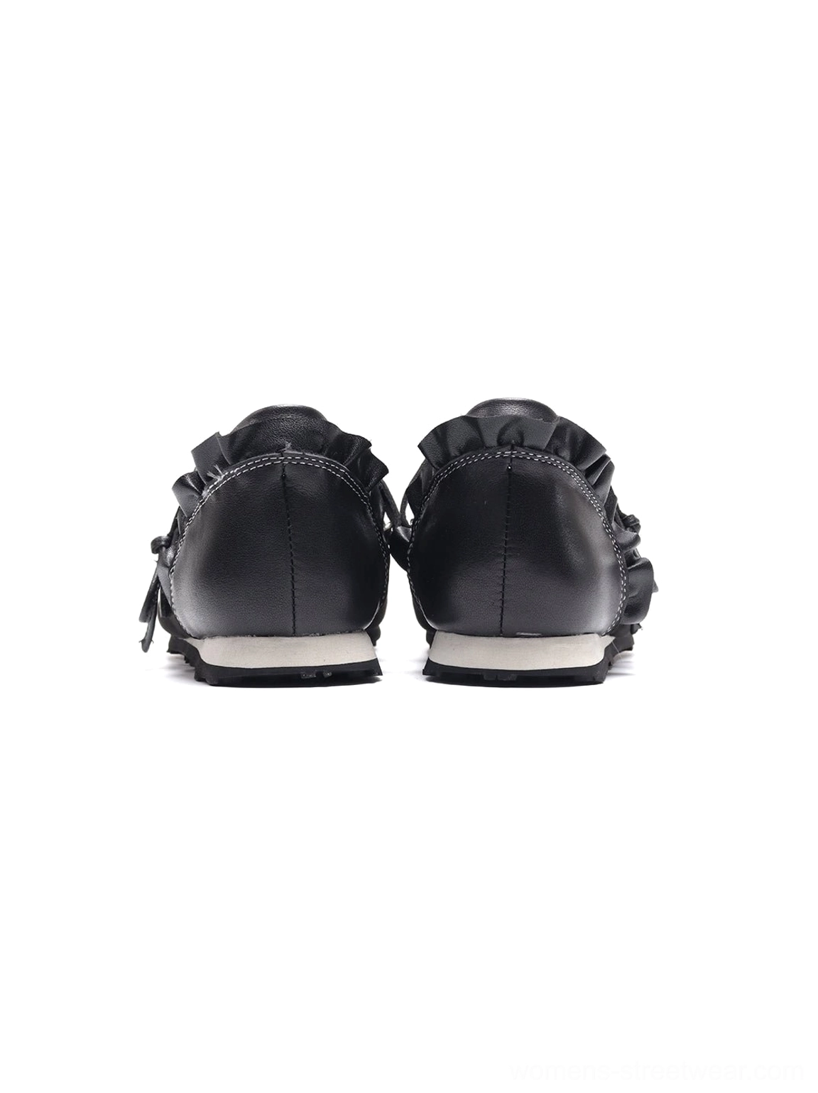 Rear view of black Mary Jane ballet flats showing ruffled heel collar, neat upper stitching and flat white rubber outsole