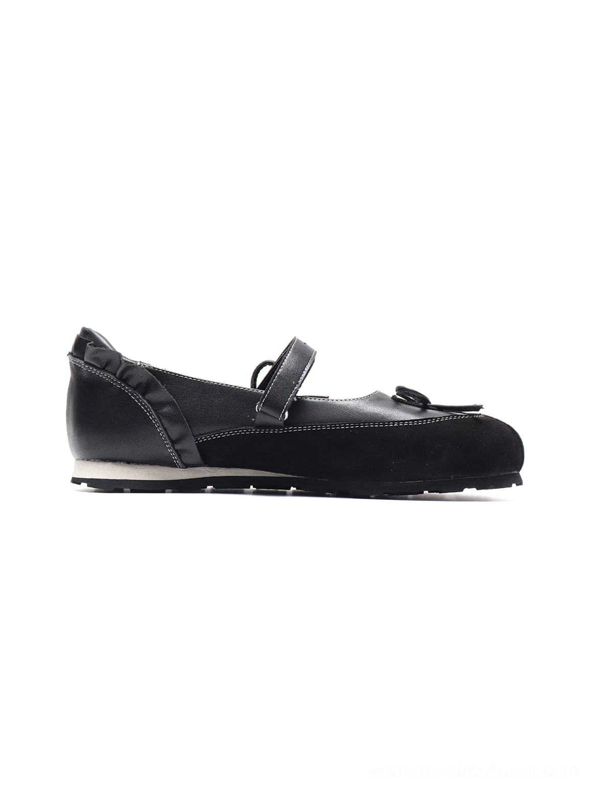 Black bow Mary Jane ballet flat side view with slim instep strap, front bow, contrast stitching and segmented rubber sole