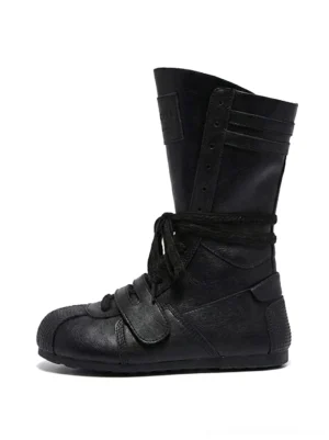 Black leather-look boxing-inspired mid-calf platform boot shown from the left side with wraparound laces, front hook-and-loop strap, ribbed shaft details, and structured streetwear silhouette