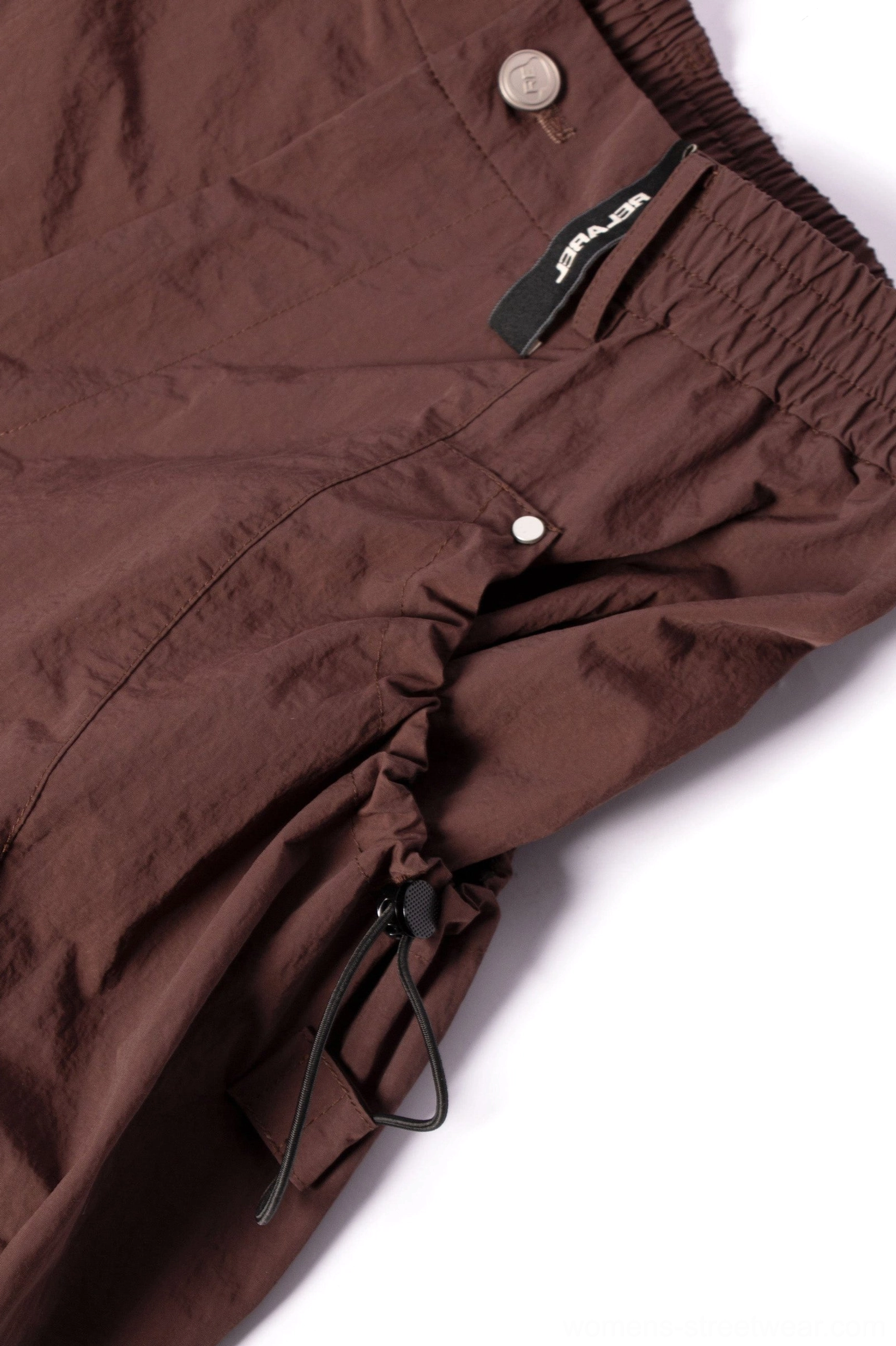Black and brown wide leg streetwear cargo pants designed for layered Seoul inspired urban outfits