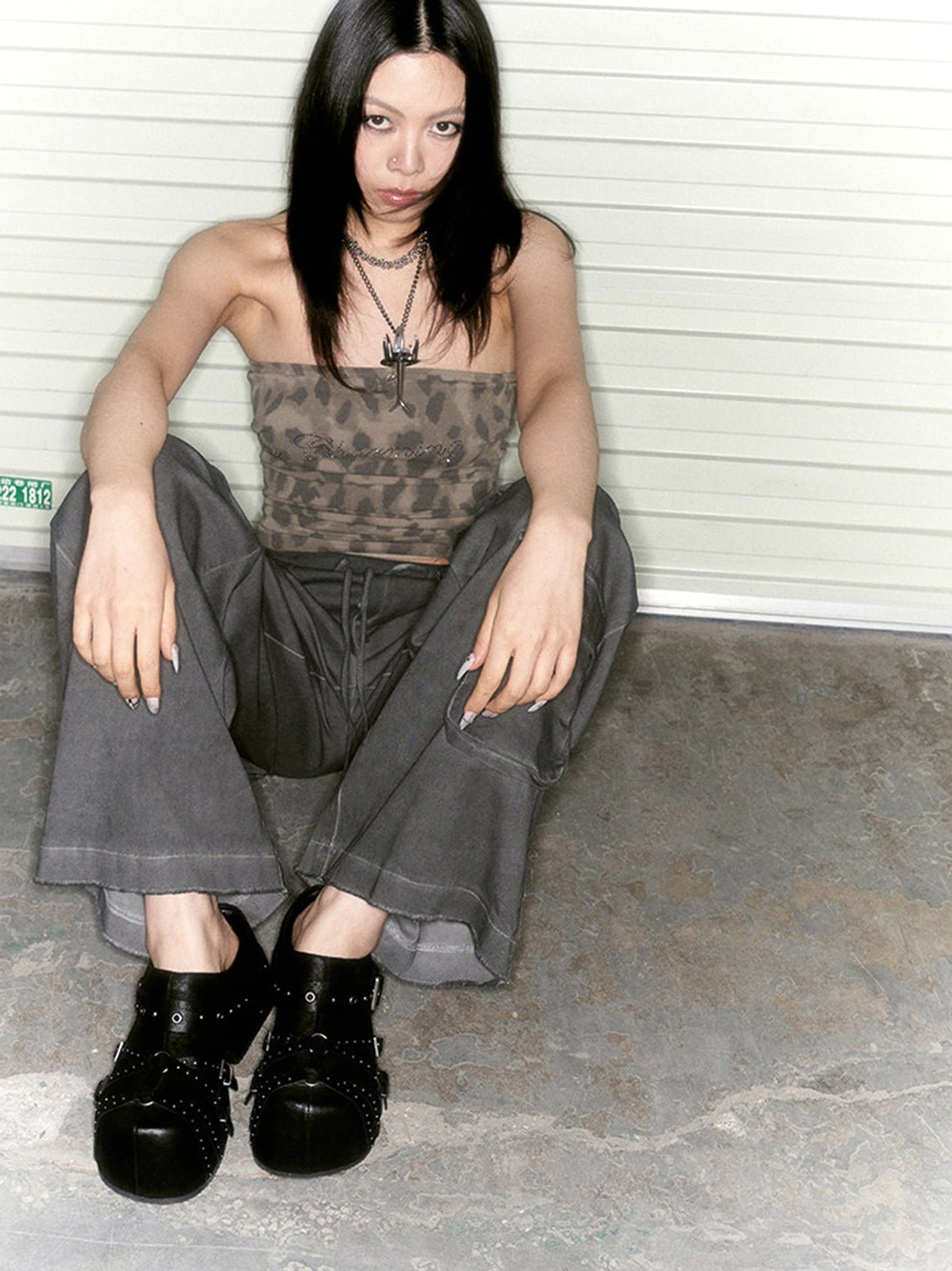 Black buckle platform mules with silver studs and closed toes worn in an edgy Y2K casual outfit