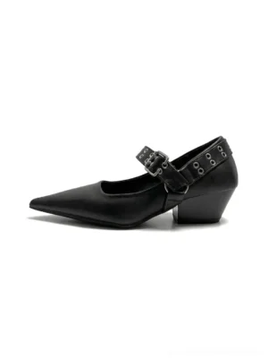 Black pointed Mary Jane pumps with wide buckle strap, metal eyelets, smooth leather-look upper, and low block heel shown in side profile