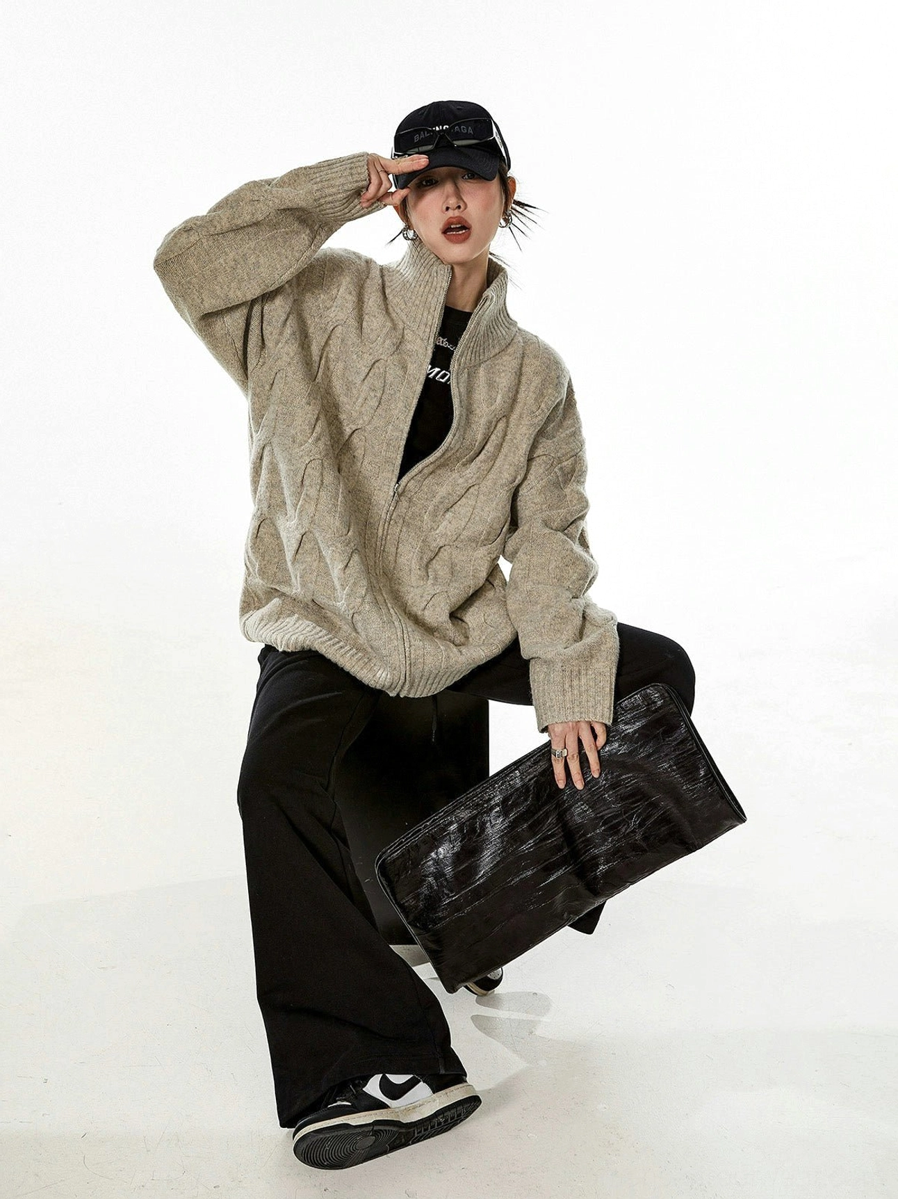 Black cable knit cardigan oversized fit pockets ribbed trim functional streetwear