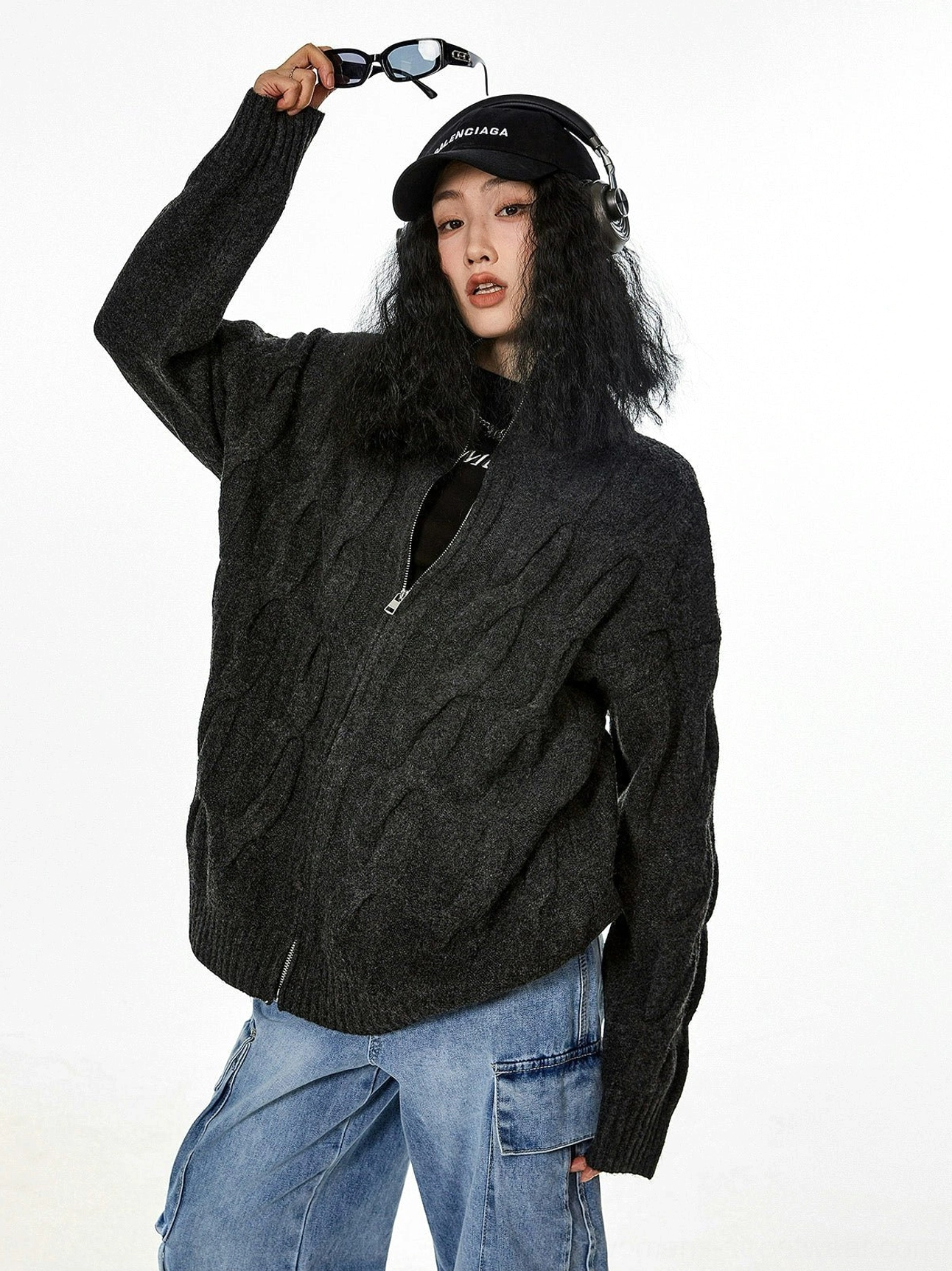 Black cable knit zip-up cardigan product detail texture quality craftsmanship