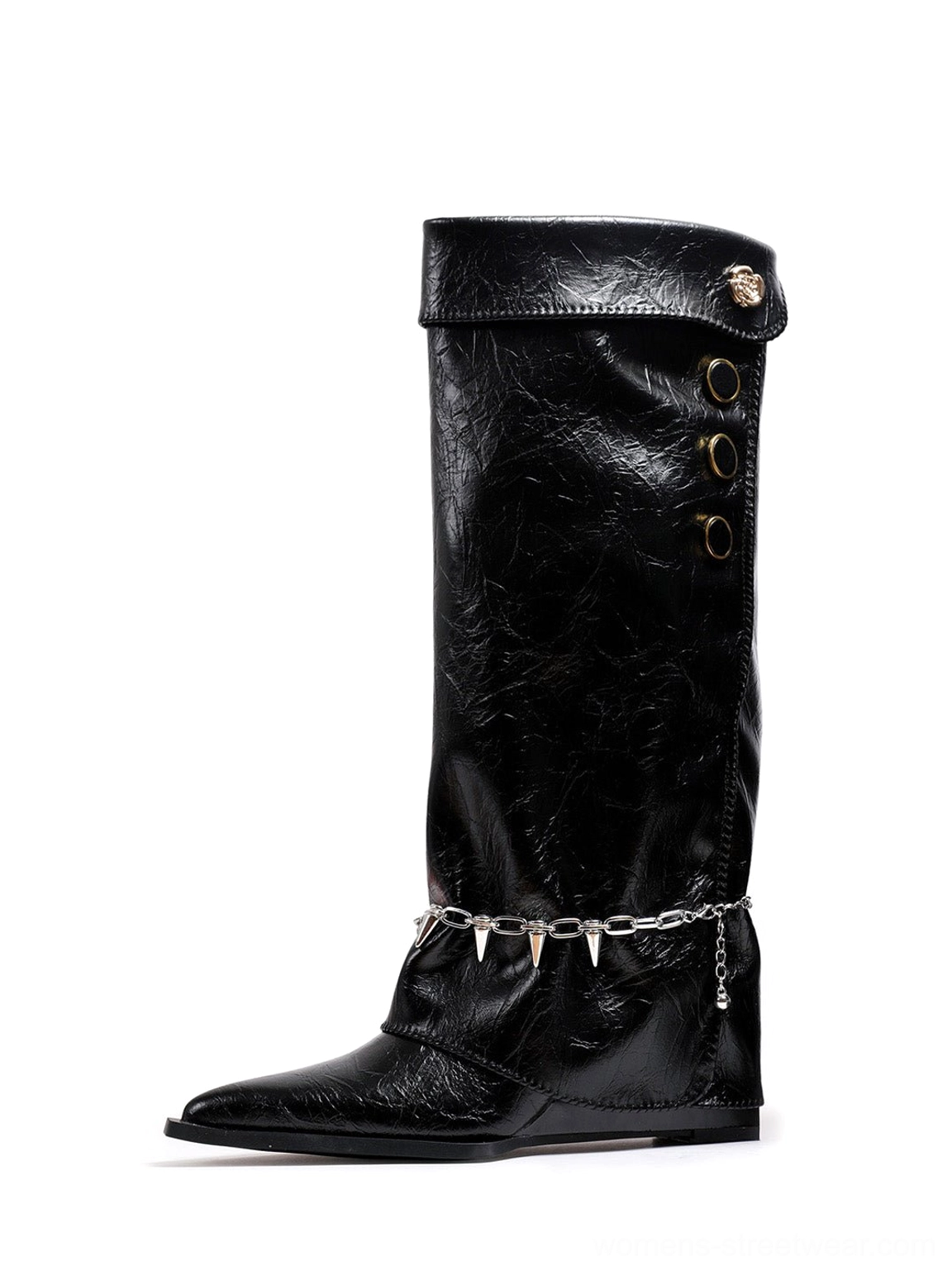 Front view of black chain-trim pointed-toe knee-high riding boots with crinkled textured finish, layered spike chain ankle hardware, fold-over shaft, and low wedge heel