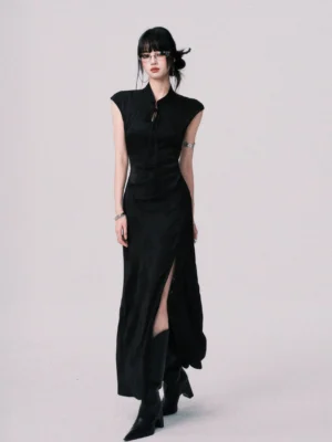 Full-body front view of a modern black cheongsam-inspired maxi dress with structured stand collar, cap sleeves, fitted waist, high side slit, and sleek streetwear silhouette