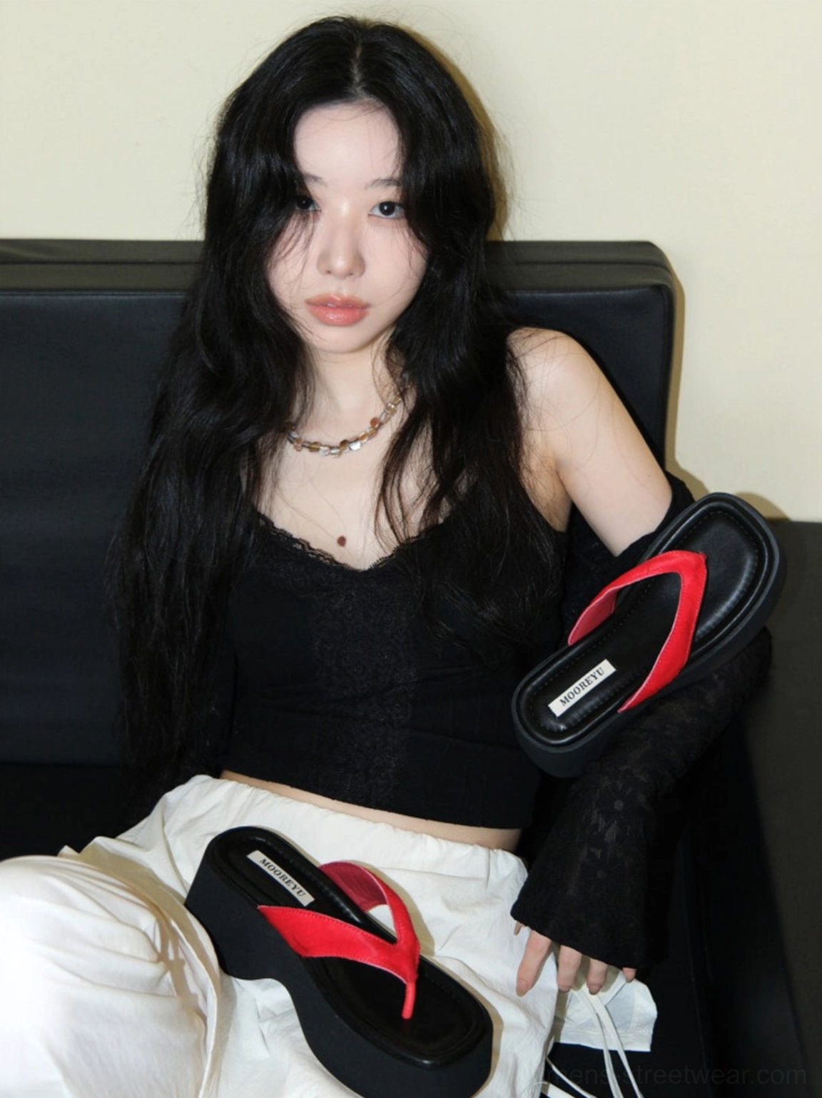 Black chunky platform flip-flops with red suede straps shown with a casual monochrome outfit