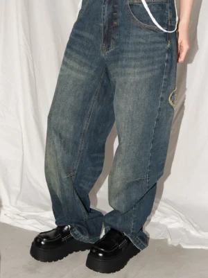 Women's black chunky platform loafers styled with vintage wide-leg jeans to show the elevated Y2K streetwear effect