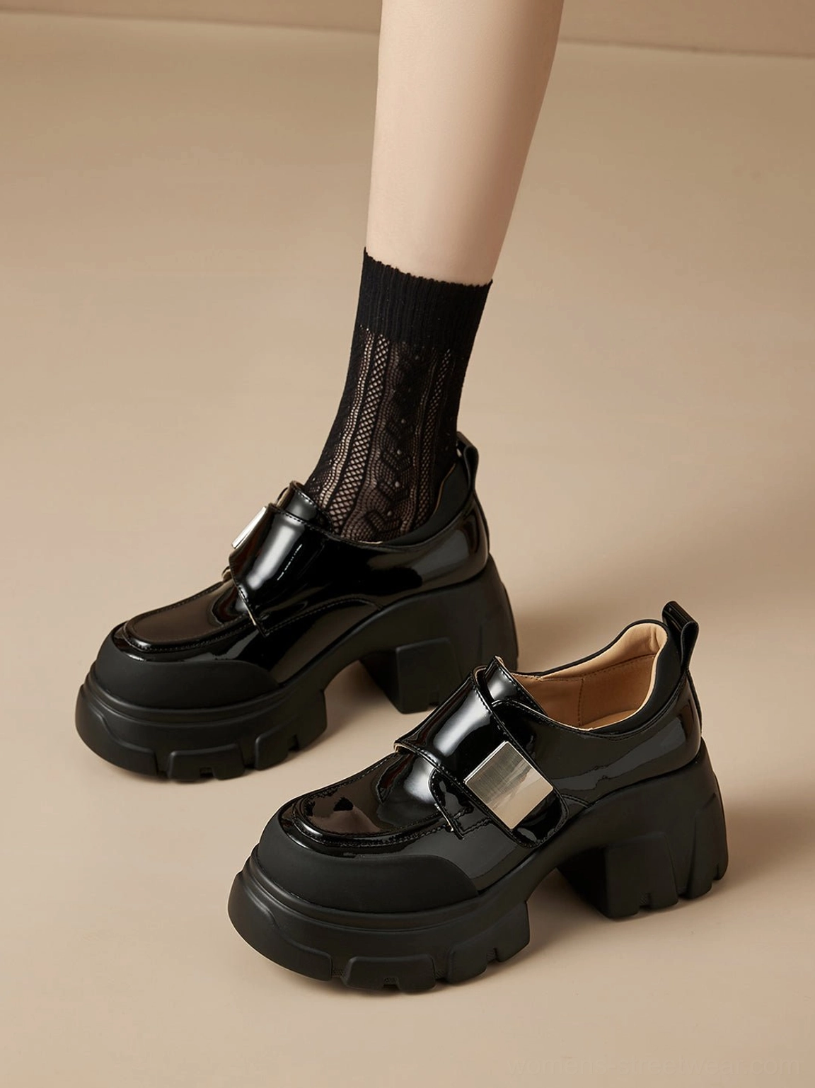 Black chunky platform Mary Jane shoes shown in a flat lay with rounded toe and textured lug outsole