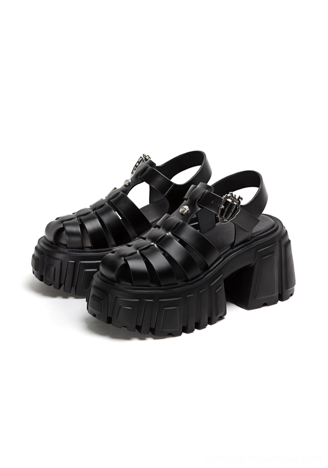 Black chunky Roman platform sandals with caged upper, heart-shaped ankle buckles, and deep lugged outsole