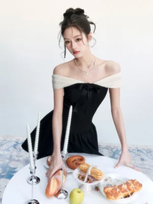 Black fitted bow mini dress with contrast off-shoulder neckline styled for a romantic Korean fashion dessert date outfit
