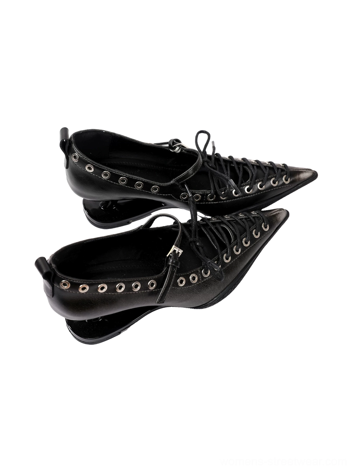 Low side-angle studio view of black corset lace pointed Mary Jane pumps with circular silver grommets and sculpted wedge heels