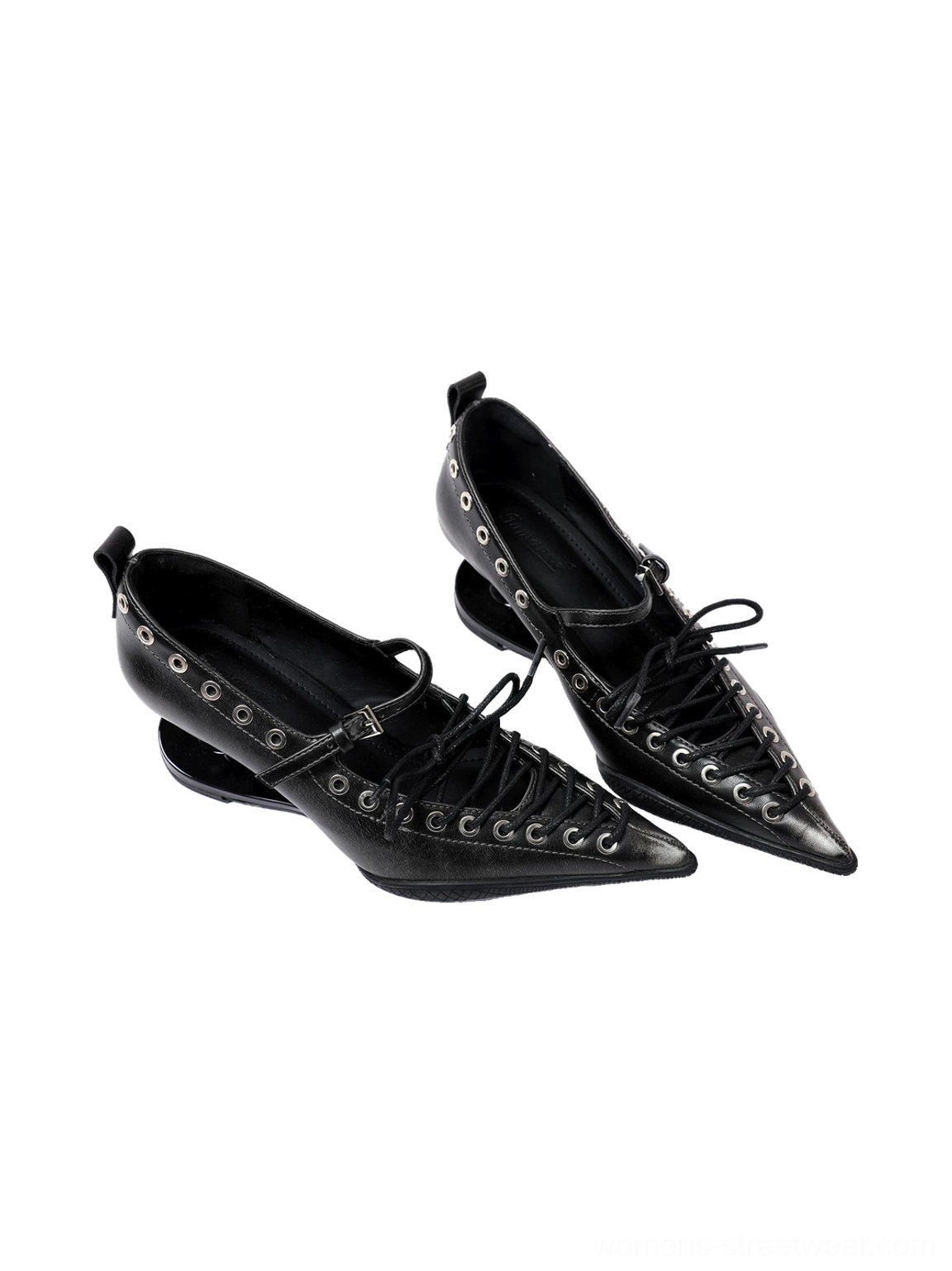Three-quarter product view of black corset lace pointed pumps with polished synthetic leather upper, buckle strap, and low wedge heel