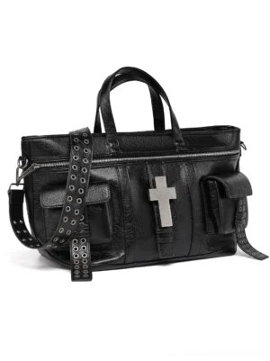 Black cracked leather cross tote bag front view with silver cross hardware, top handles, zip closure, and detachable eyelet-studded shoulder strap