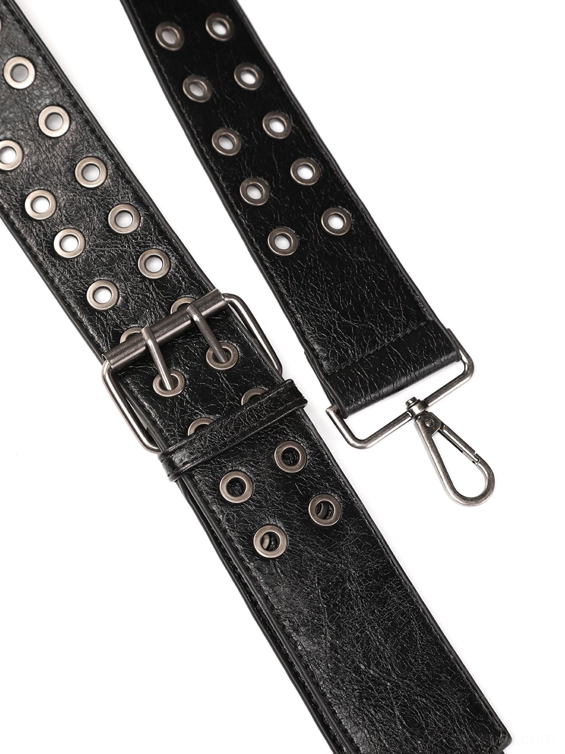 Close-up flat lay of detachable black cracked leather shoulder strap with metal eyelets, adjustable buckle, and snap-hook hardware