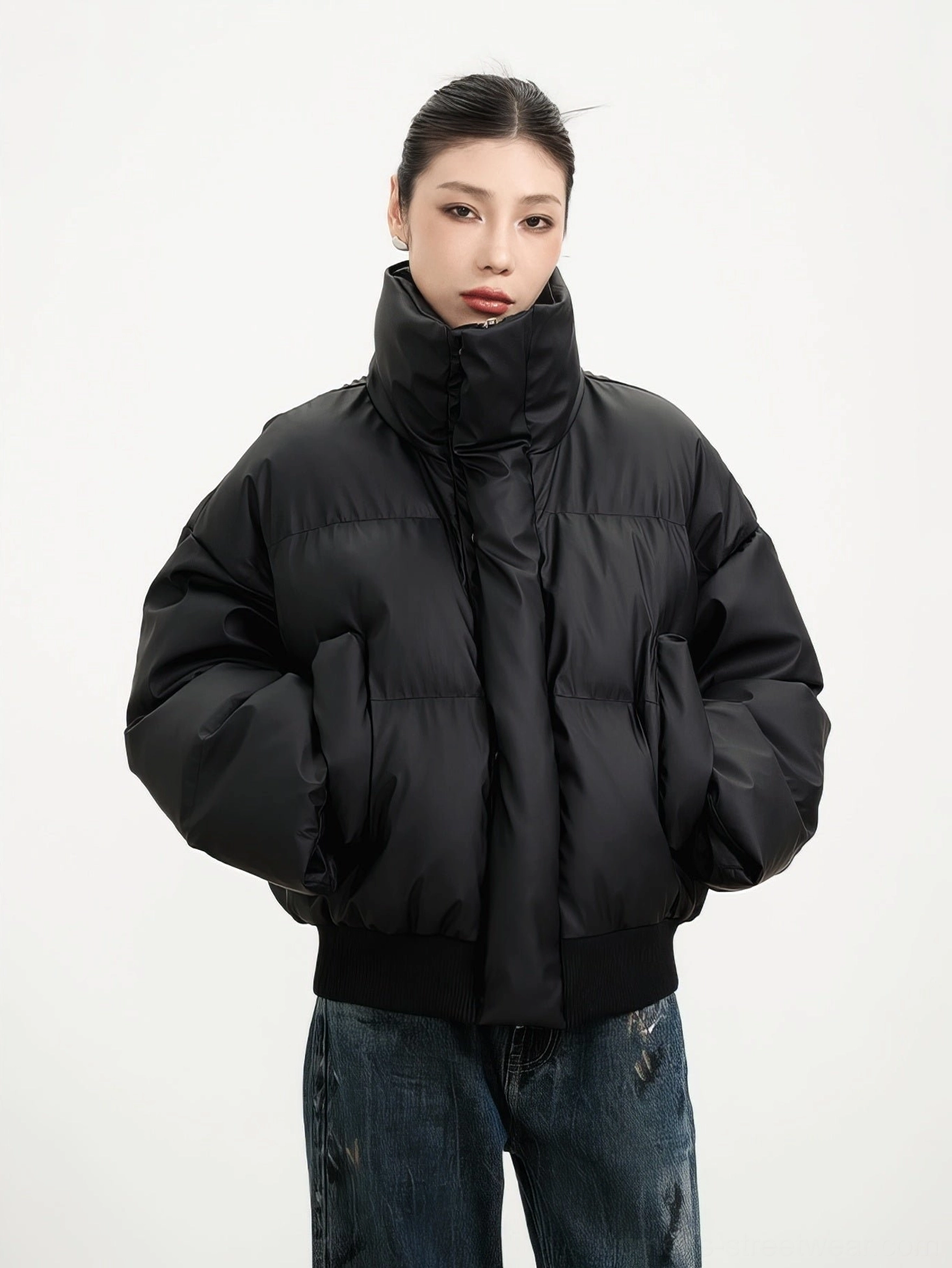 Black cropped puffer winter jacket with matte quilted finish high stand collar ribbed hem and side pockets