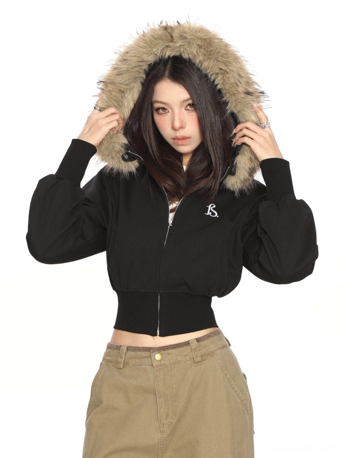 Black cropped zip-up faux-fur hood sweatshirt shown partially unzipped with plush hood detail in studio