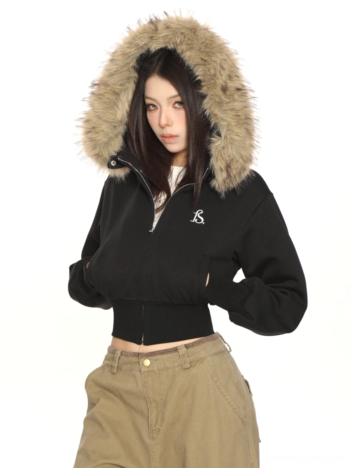 Black cropped zip-up sweatshirt with detachable faux-fur hood and embroidered chest detail paired with khaki cargo pants