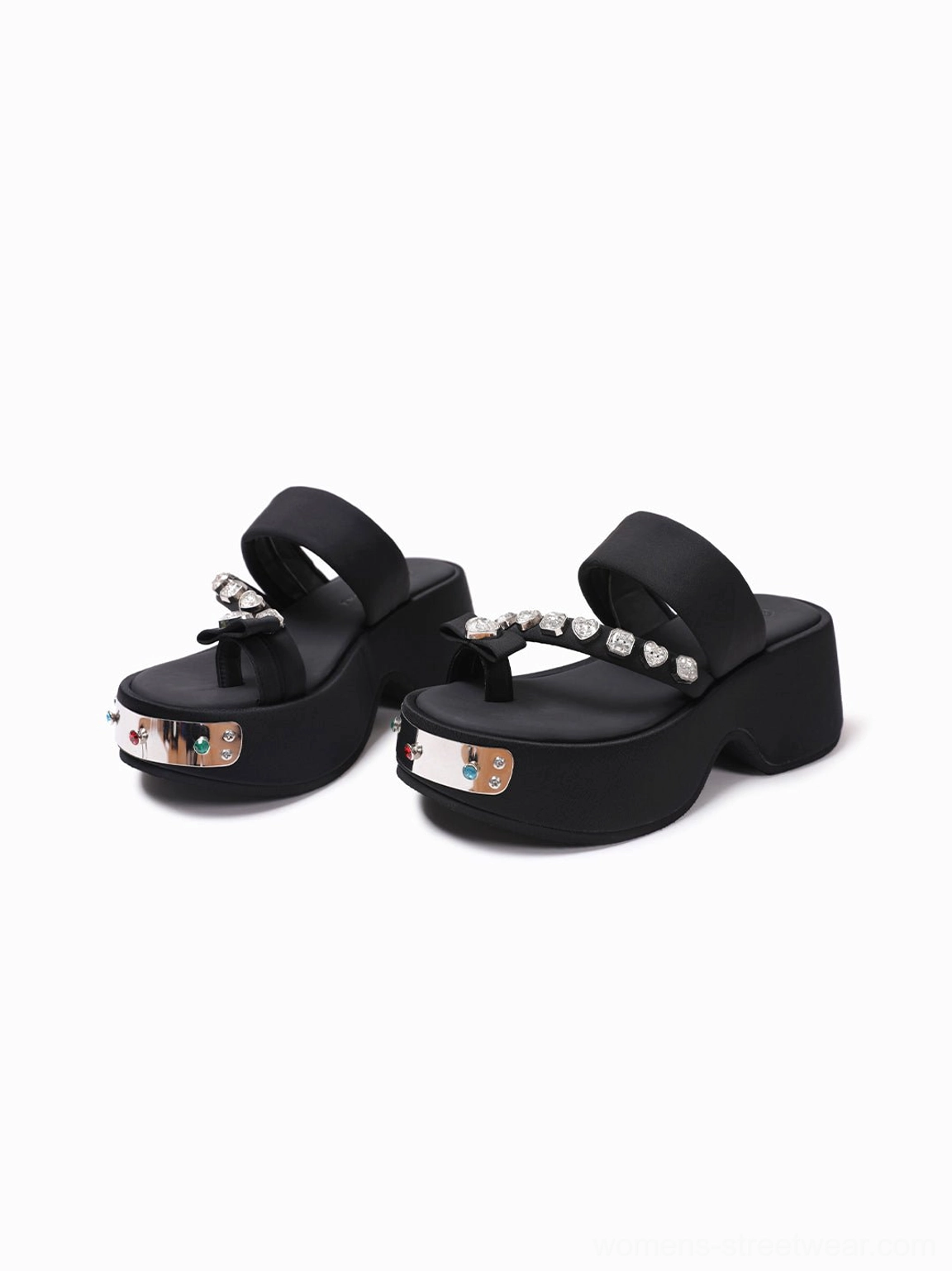Angled front view of black crystal platform slides displaying the open toe, thong strap, colorful gem details, and bold black platform sole
