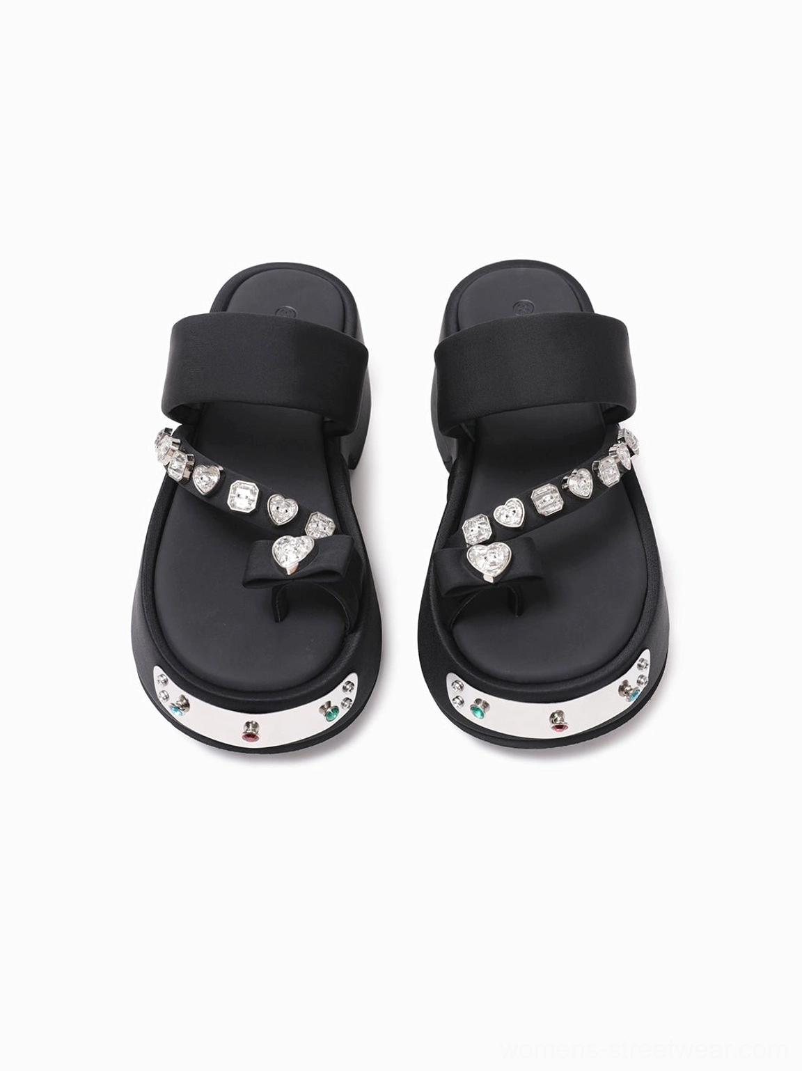 Top-down view of black crystal platform thong sandals with heart-shaped crystal charms, silver gemmed toe caps, and visible shoe interiors