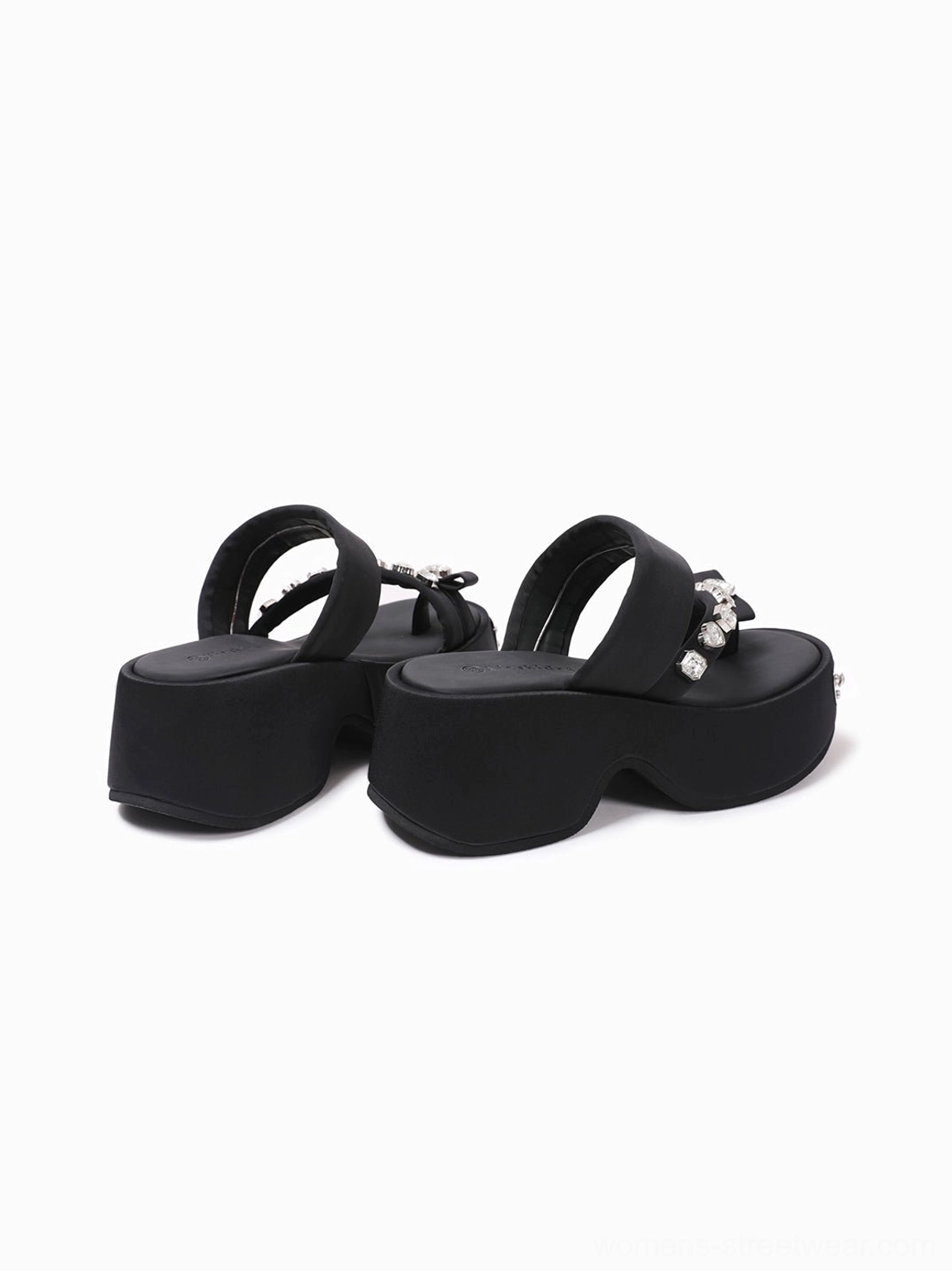 Rear side view of black crystal platform thong slides highlighting the chunky black sole, decorative hardware, open slip-on construction, and elevated silhouette