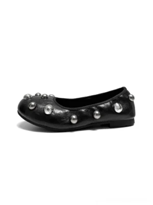 Black crystal stud ballet flats shown in side profile with a rounded toe, silver embellishments, smooth black upper, and low flat sole