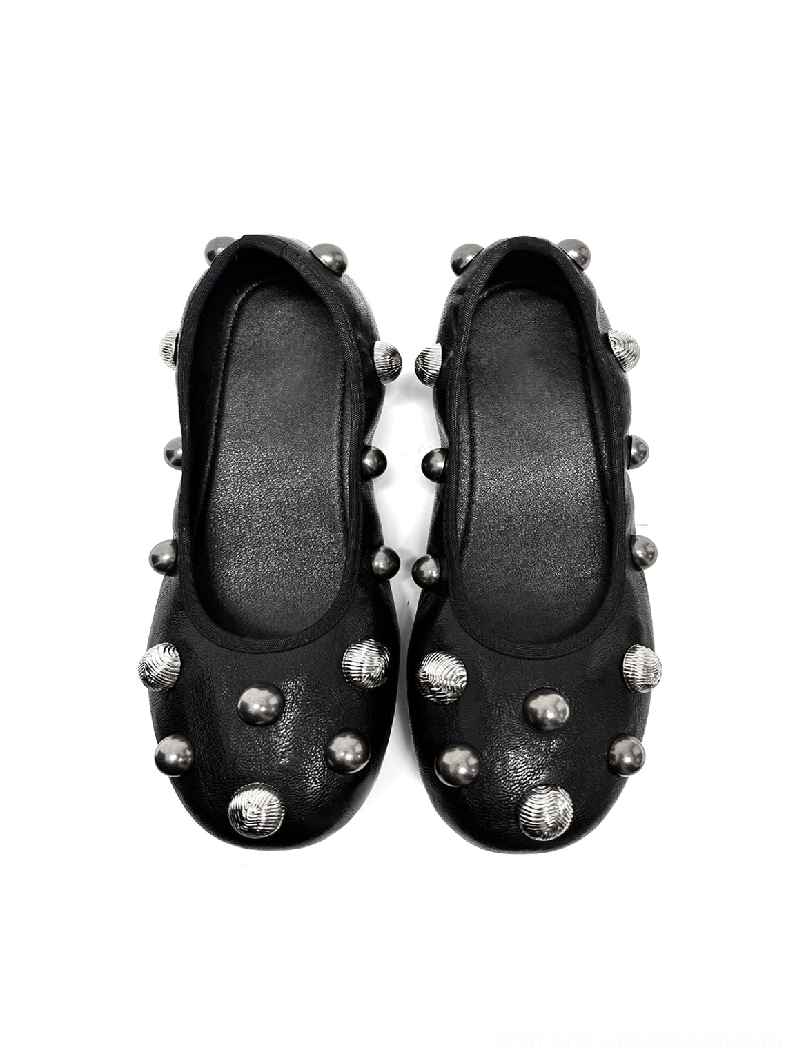 Pair of black crystal stud ballet flats displayed on a white background with mixed silver round studs and classic rounded silhouettes