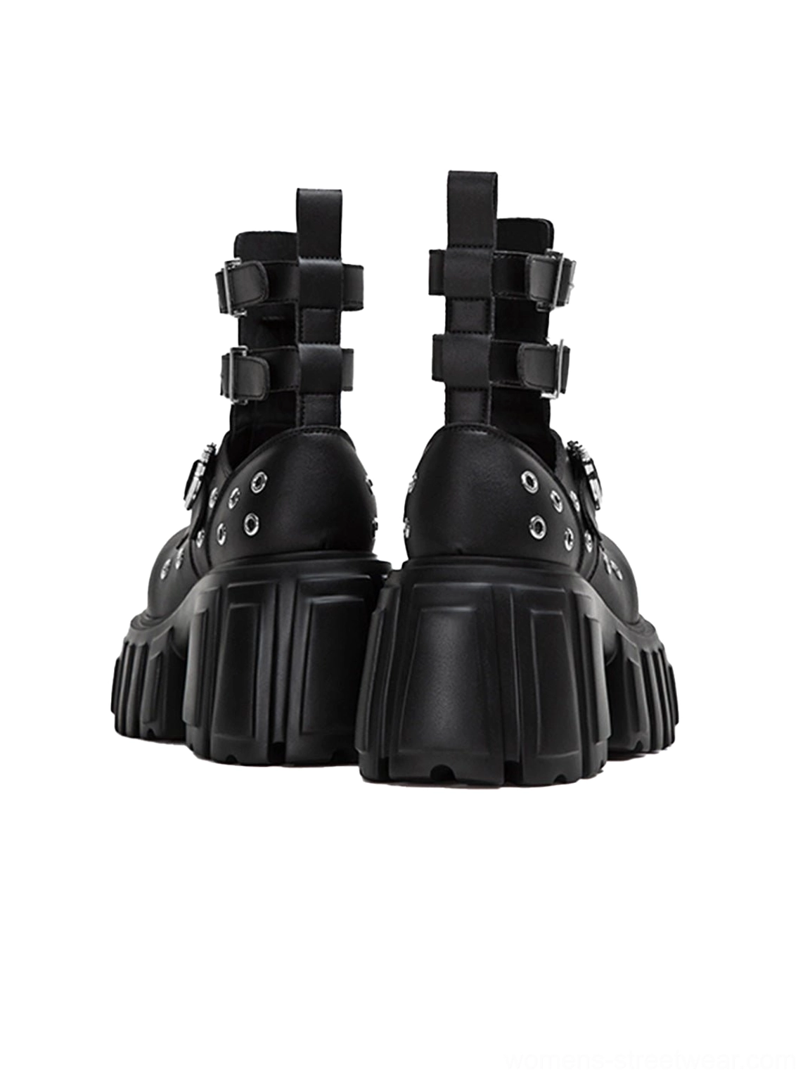 Rear three-quarter view of black cutout platform ankle boots showing heel straps rear construction and heavy lugged platform soles