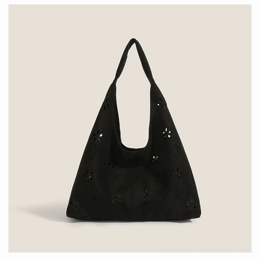 Black daisy cutout suede-effect hobo tote bag with relaxed slouchy shoulder bag silhouette