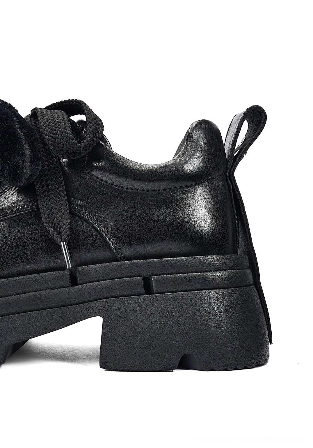 Black detachable plush charm platform derby shoes for women with glossy upper, chunky lug sole, rope laces, and bold streetwear silhouette