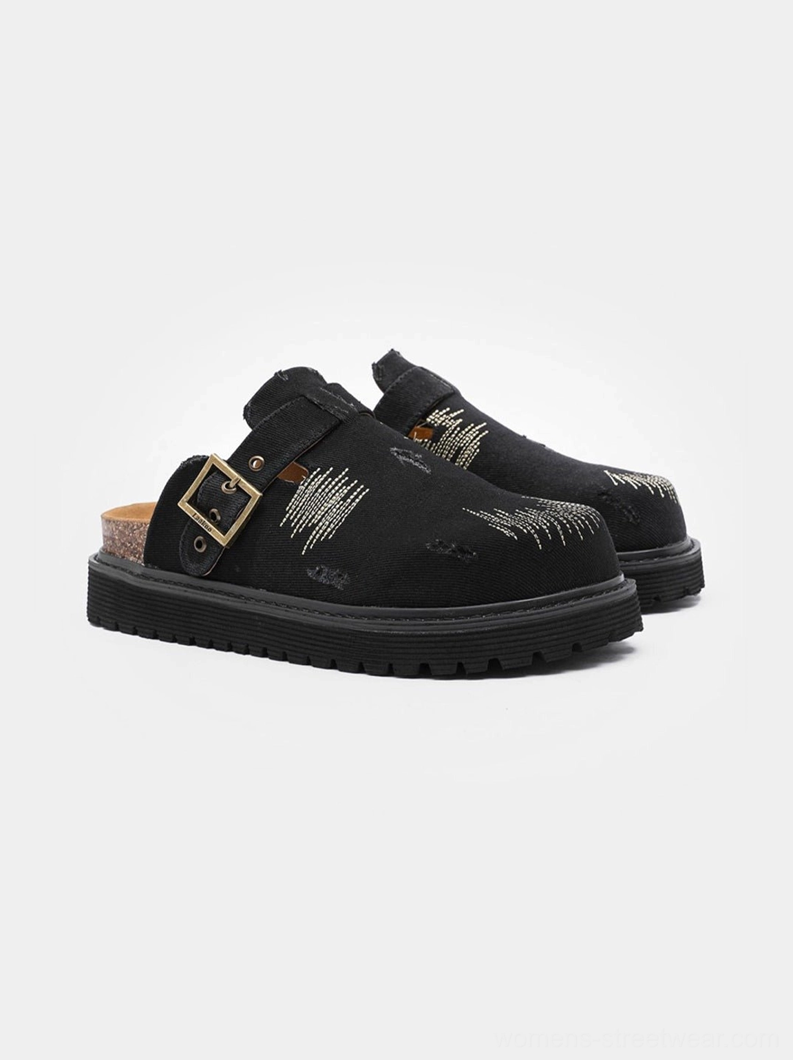 Black distressed denim platform mule clogs with antique brass buckle, scratch embroidery, cork footbed, and chunky rubber outsole