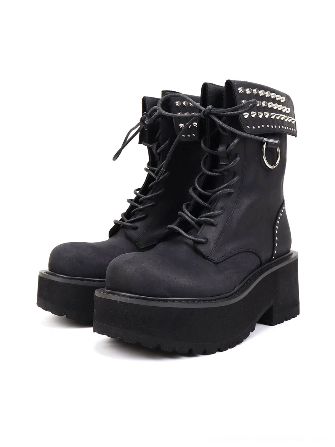 Front three-quarter view of black distressed leather platform combat boots with studded fold-over ankle cuffs, laces, and chunky lugged soles