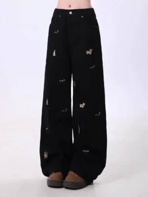 Black high waisted wide leg denim streetwear jeans with all over cute dog embroidery front full length view