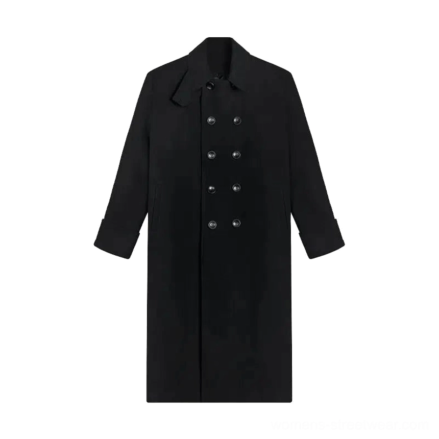 Flat lay display of a solid black double-breasted long overcoat with matte fabric, metal buttons, notched lapel, and minimalist design