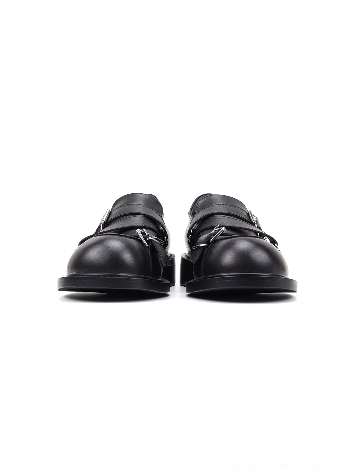 Front view of black double-buckle block-heel loafers with two silver fastenings on each shoe and a sleek rounded silhouette