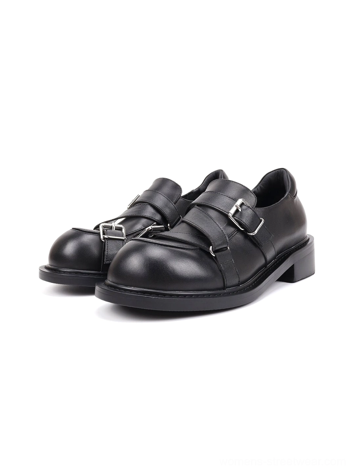 Pair of black double-buckle block-heel loafers shown from a three-quarter front angle with silver buckle straps and rounded closed toes