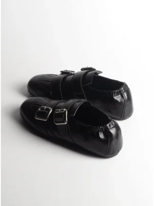 Pair of black double-buckle leather loafers with polished finish and silver buckle straps