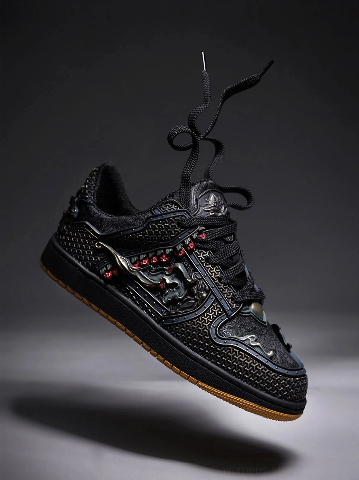 Black dragon embroidered low-top sneakers with layered panels and gum rubber sole for contemporary streetwear styling