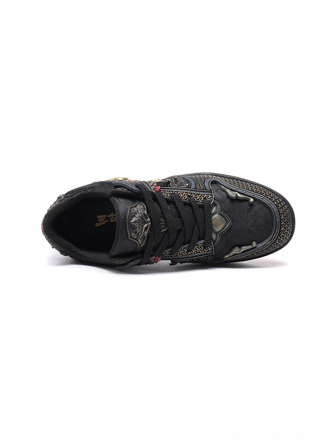 Black dragon sneakers for urban outfits with perforated texture, bronze-inspired ornamentation, and vintage gum sole