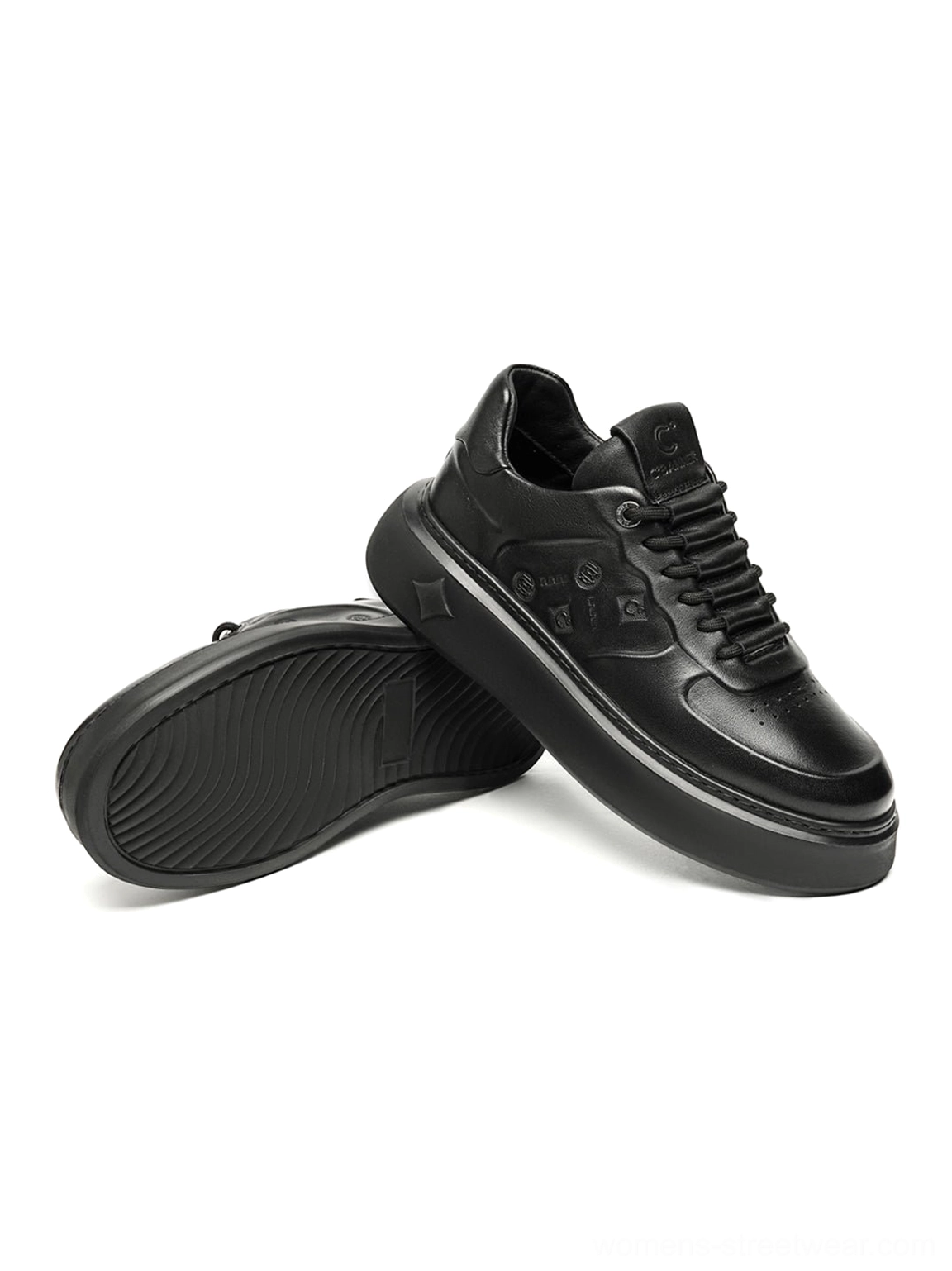 Black embossed platform low-top sneakers product image showcasing a monochrome streetwear footwear design