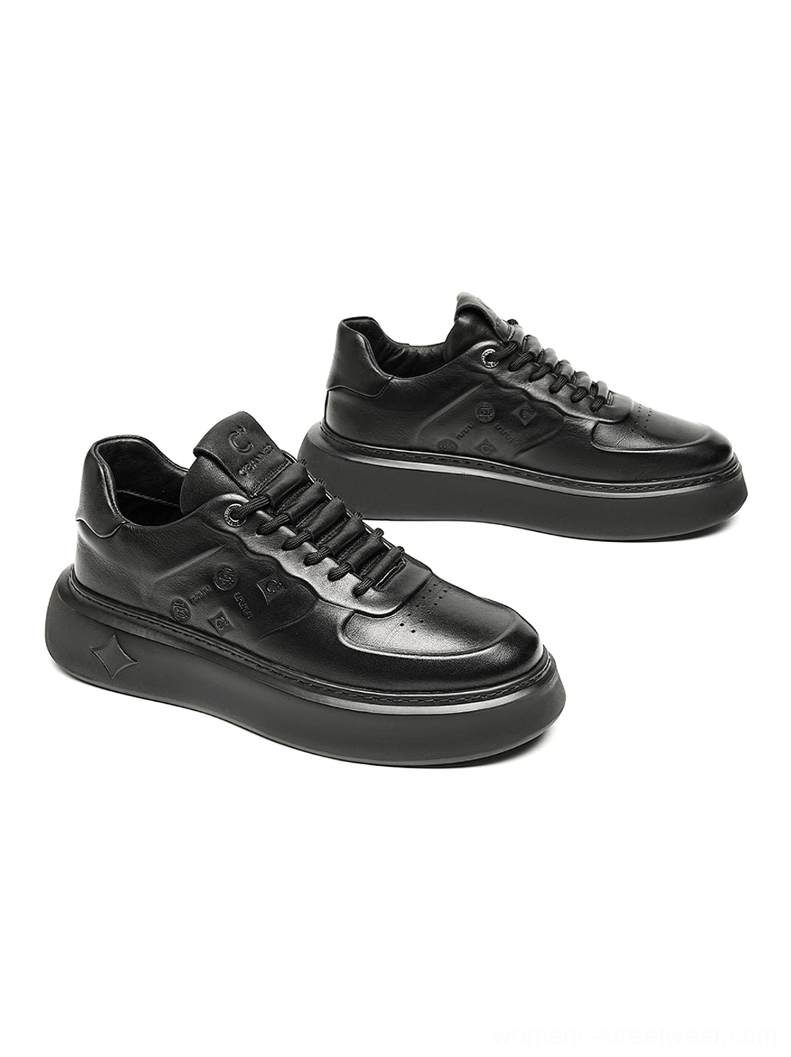 Black embossed platform low-top sneakers with thick black sole for Korean-inspired everyday streetwear styling