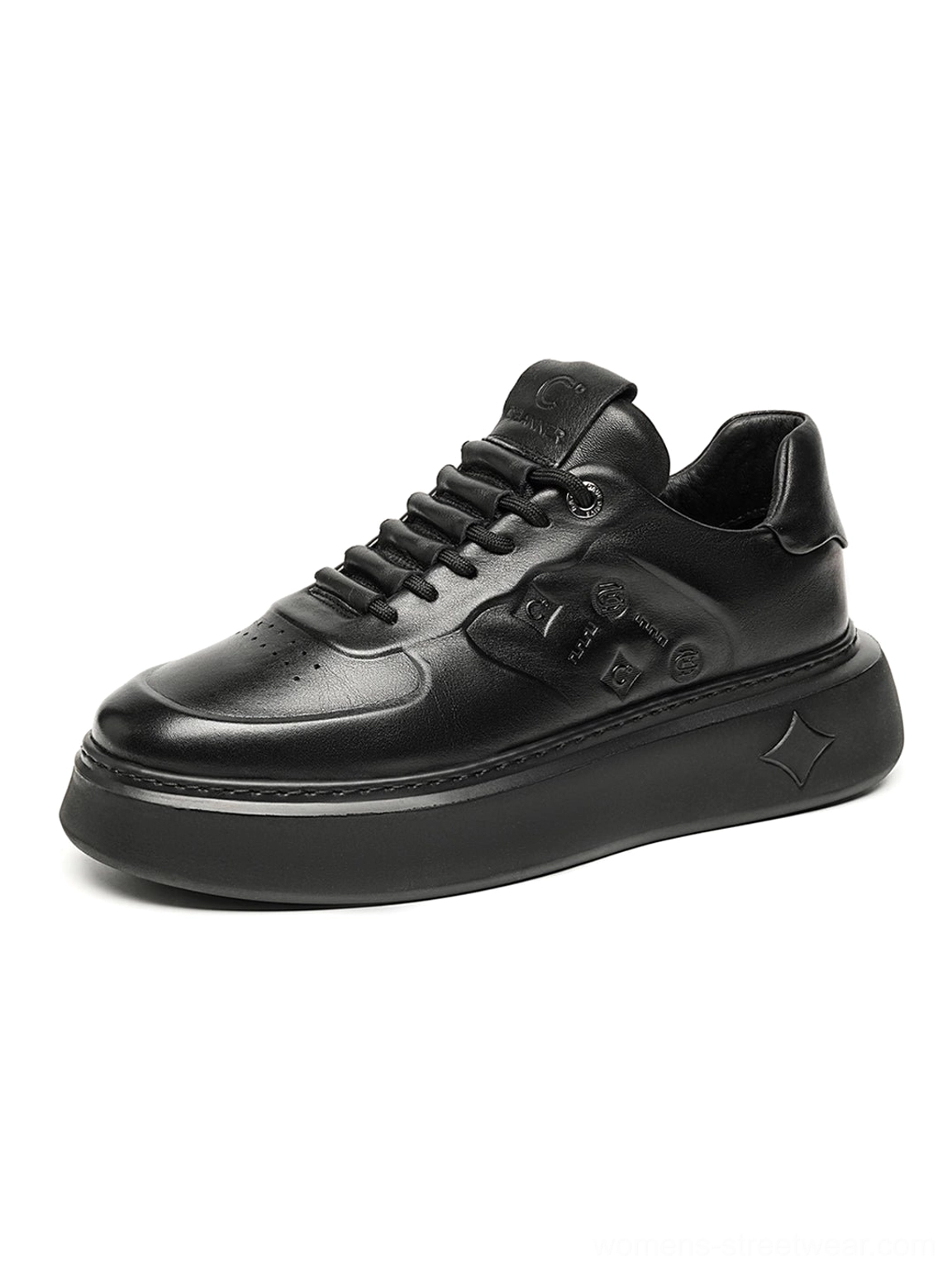 Black embossed platform low-top sneakers detailed product view with tonal laces and textured black upper