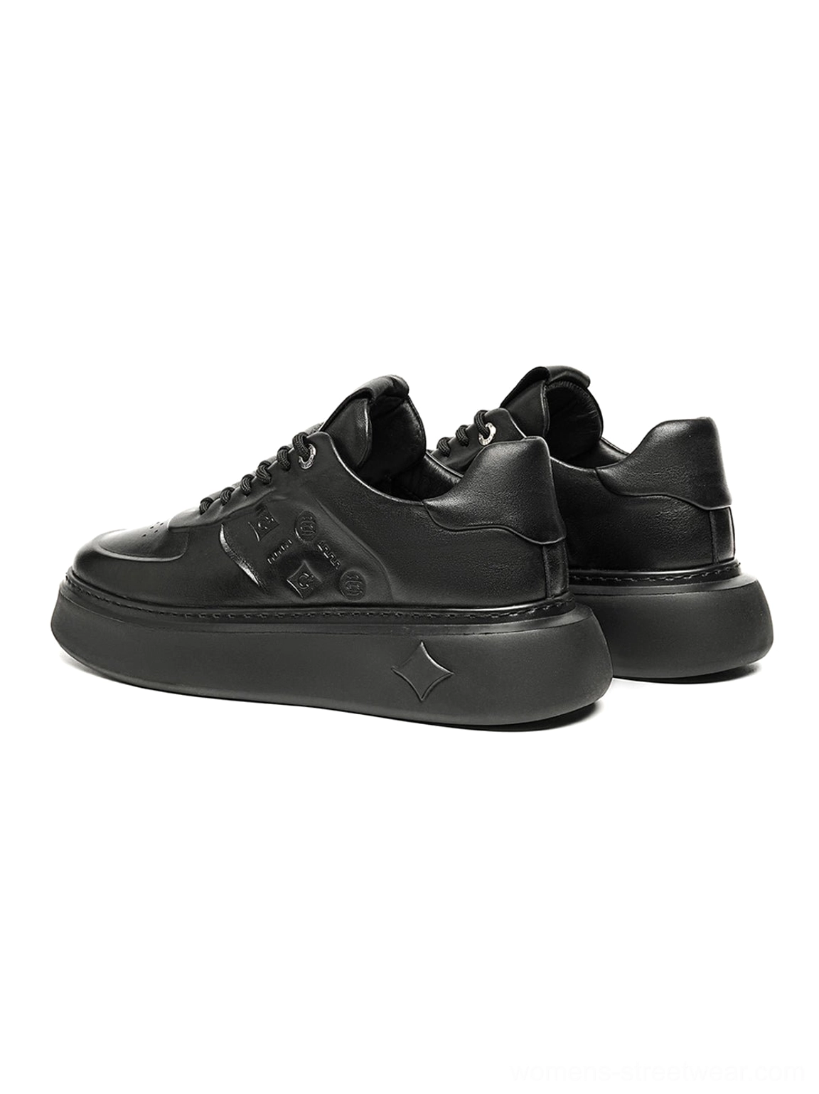 Black embossed platform low-top sneakers final product view featuring tonal panels and lace-up closure