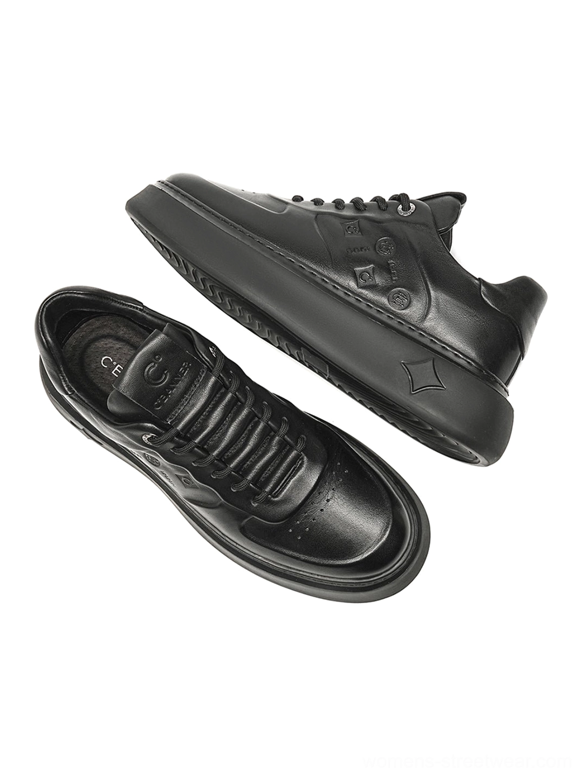 Black embossed platform low-top streetwear sneakers product detail highlighting the sculpted platform profile