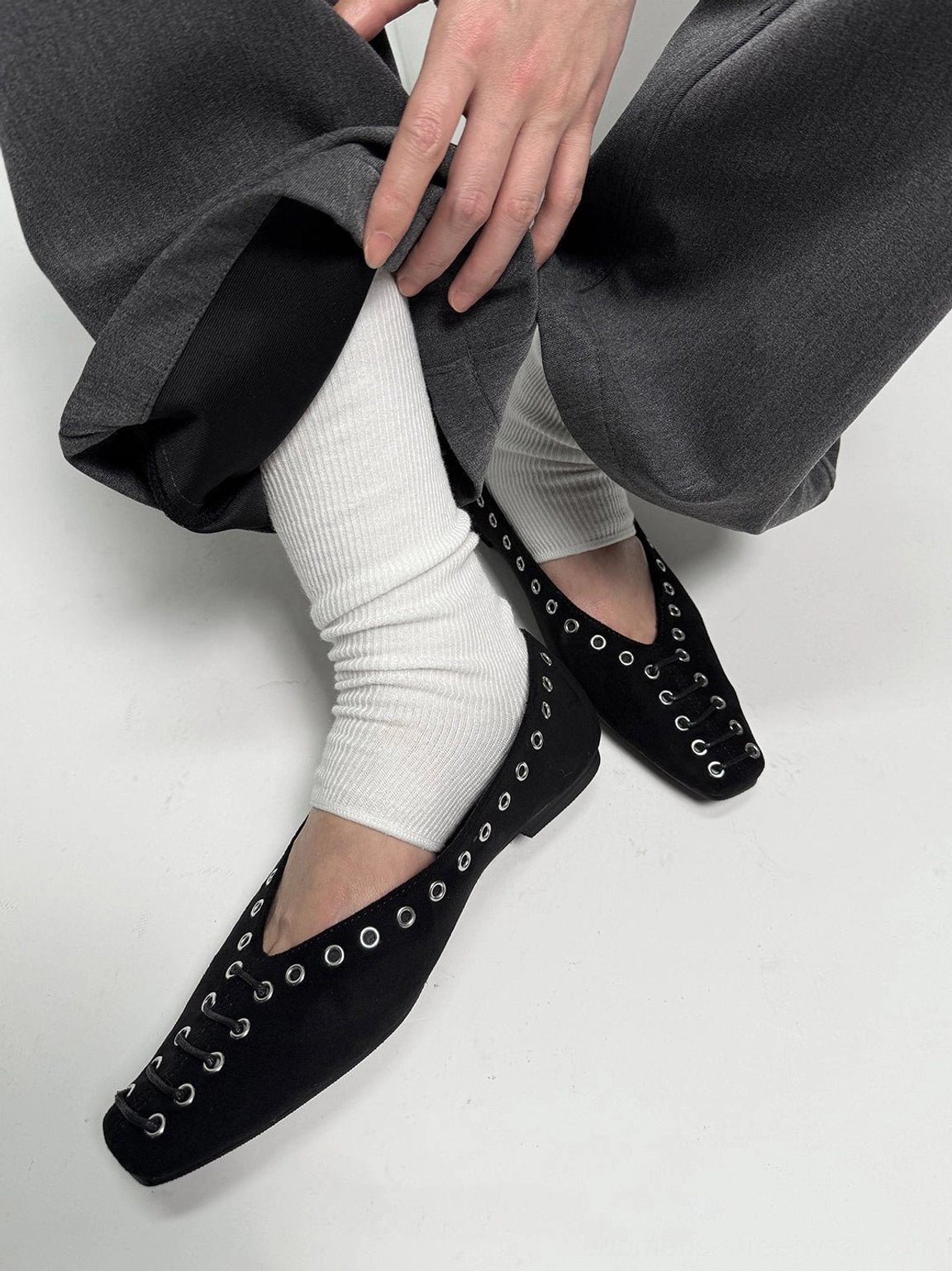 Black eyelet-trim square-toe ballet flats with a minimalist Acubi streetwear silhouette and flat sole
