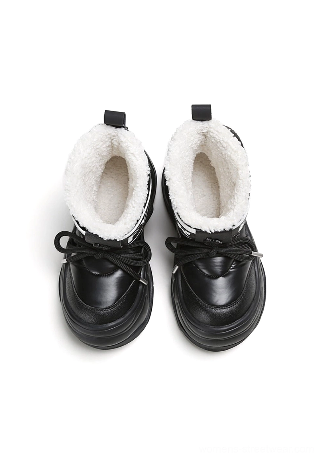 Top view of black faux fur chunky moon boots featuring lace-up fronts, plush white collars and heel pull tabs