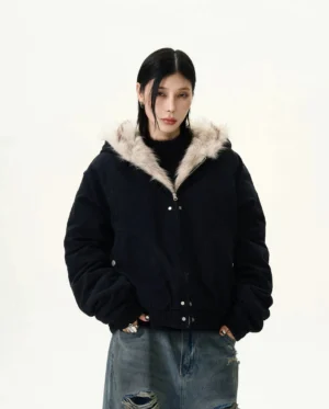 Black hooded faux fur trim bomber jacket back three-quarter view showing relaxed boxy streetwear fit