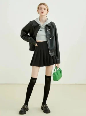 Full-body Korean streetwear outfit featuring black faux leather toggle zip jacket with pleated mini skirt and loafers
